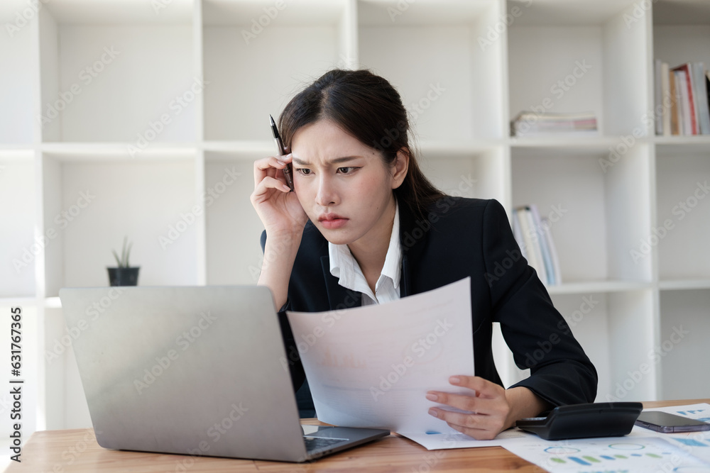 Tired and upset young businesswoman feeling exhausted from working in the office too long. Tired and upset young businesswoman feeling exhausted from working in the office too long.