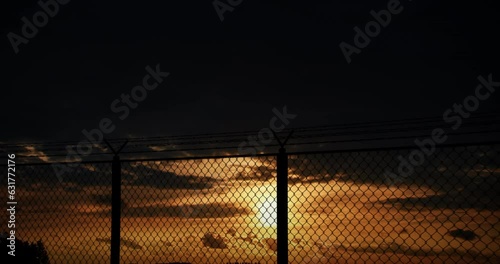 Barbed Wire Fences and Time Lapse Clouds.