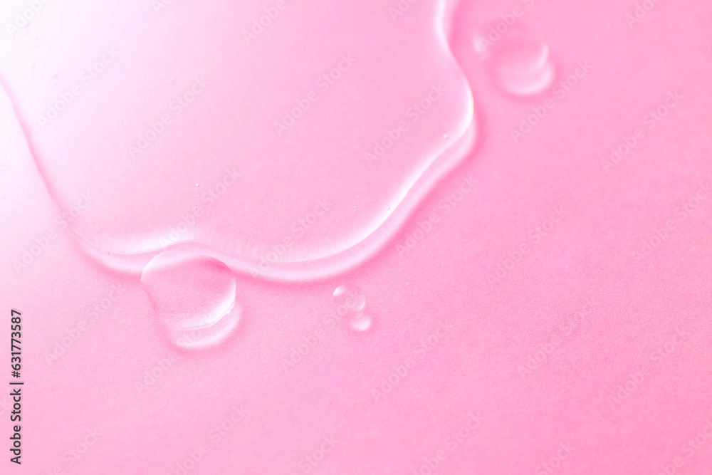 Cosmetics serum fluid gel flowing over pink background, hyaluronic acid cream texture, facial treatment. Wet backdrop, water. Shower gel, shampoo Transparent serum oil texture, hydrating, moisturizing Cosmetics serum fluid gel flowing over pink background, hyaluronic acid cream texture, facial treatment. Wet backdrop, water. Shower gel, shampoo Transparent serum oil texture, hydrating, moisturizing