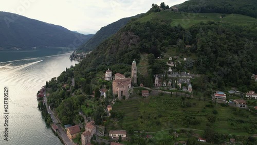Aerial footage of the parish church Madonna del Sasso stands on the high hill of Vico Morcote. Morcote at the Lake Lugano was once credited as one of the most beautiful Swiss villages