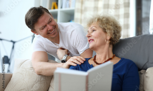 Fotografie Portrait of happy cheerful relatives smiling at home