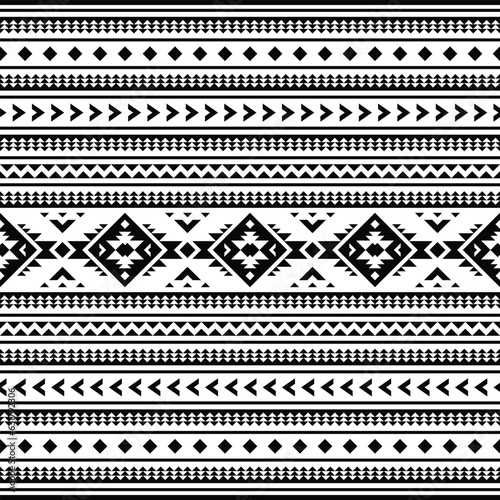 Geometric seamless pattern with Aztec tribal motives in black and white colors. Abstract background with ethnic style design for textile and decorative.