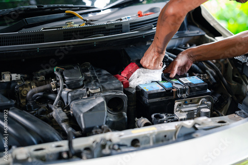 professional engineer, a man person fix, repair, and maintenance the battery of the car