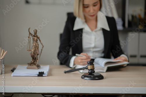Lawyers Asiawoman   having through online Concepts  of Legal services at the law office. photo
