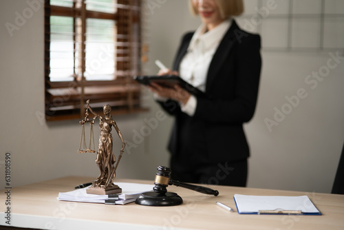 Lawyers Asiawoman   having through online Concepts  of Legal services at the law office. photo