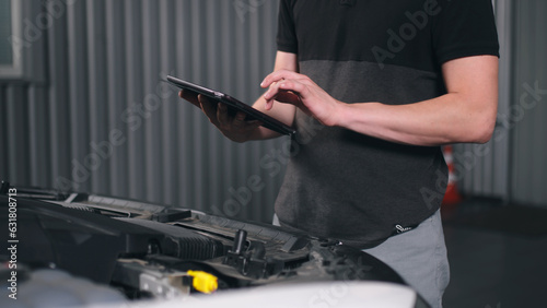 Wallpaper Mural auto car service maintenance concept, talking to a customer and talking to a car manager to check and repair a car, meeting with a client in a garage. checking the results of diagnostics, maintenance  Torontodigital.ca