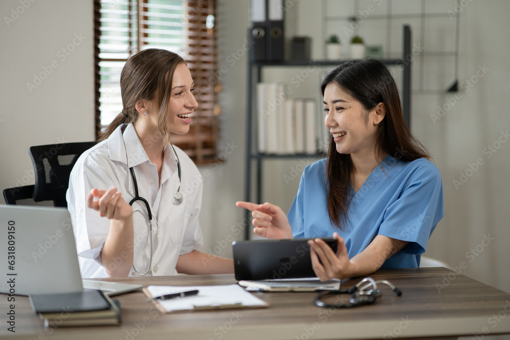 female doctor consulting with a female nurse at the clinic at the hospital female doctor consulting with a female nurse at the clinic at the hospital