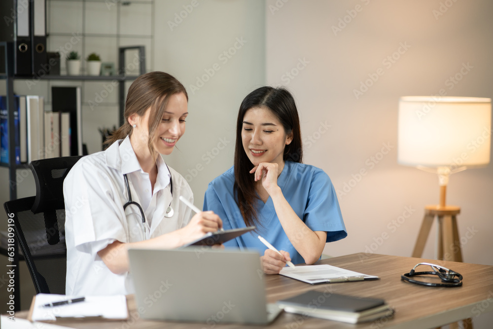 female doctor consulting with a female nurse at the clinic at the hospital female doctor consulting with a female nurse at the clinic at the hospital
