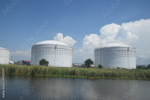 Giant tank for oil storage, which is on the edge of the river