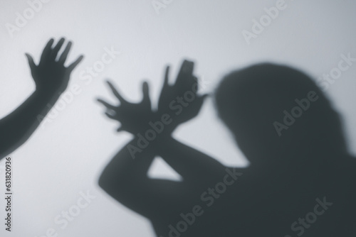 Silhouettes of quarreling parents on white background. Domestic violence concept