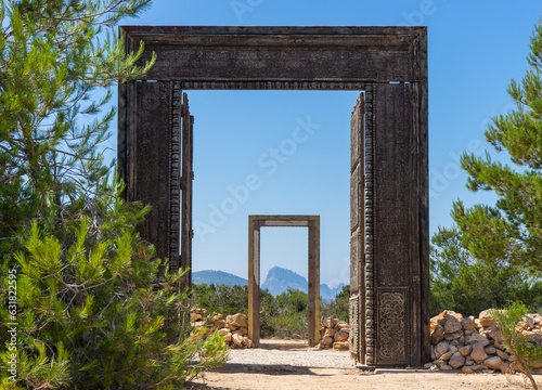 Mysterious magical doorway to another spiritual portal on island of Ibiza with Es Vedra framed in the distance