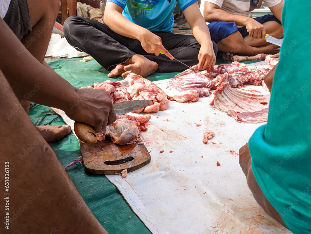 the process of cutting goat meat on Eid al-Adha