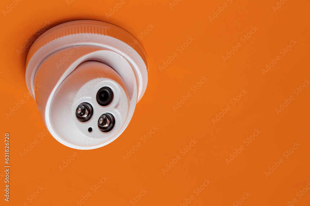CCTV camera with orange background, Smart camera can record video all day long to guard and scout the surroundings. CCTV camera with orange background, Smart camera can record video all day long to guard and scout the surroundings.