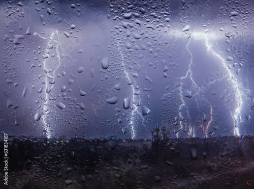 Outside the window, lightning, rain and wind, view from the window