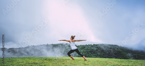Asian women relax in the holiday. Play if yoga, natural forests, mountains and mist.