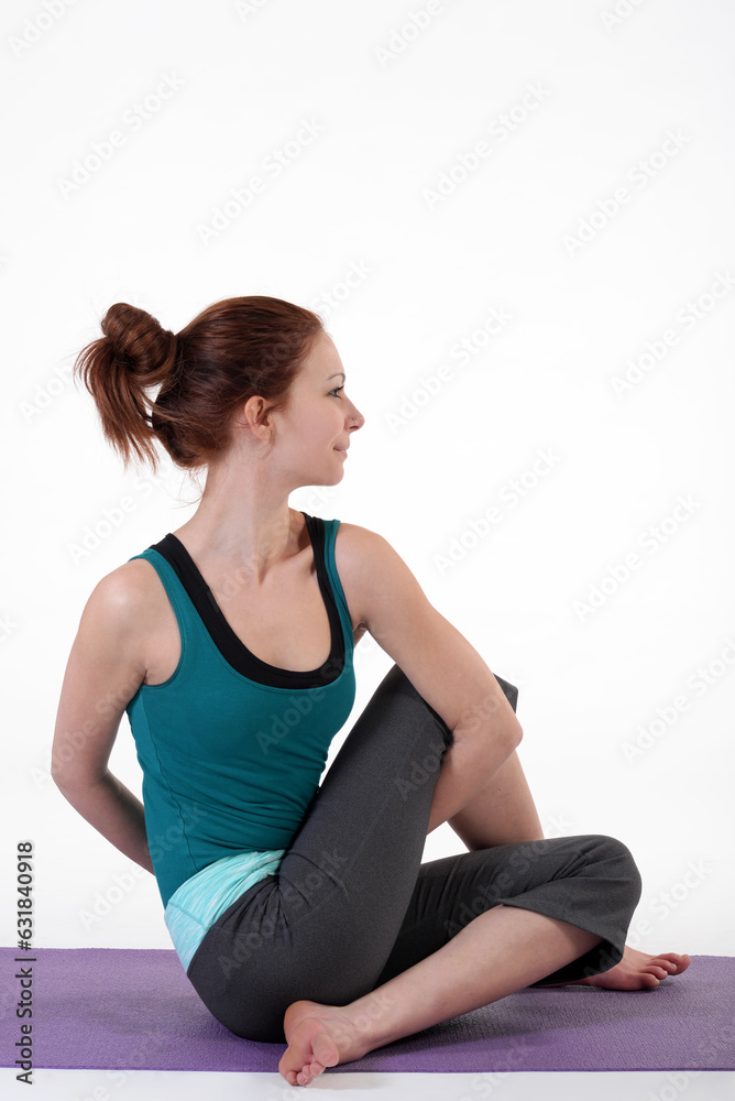 Woman doing yoga in photo studio on isolated white background. Woman doing yoga in photo studio on isolated white background.