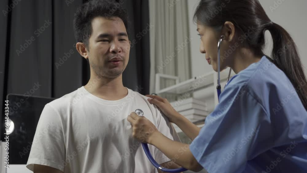 Beautiful Asian doctor measuring blood pressure for young female patient in examination room. A stethoscope is placed on the crook to listen to the heartbeat. Beautiful Asian doctor measuring blood pressure for young female patient in examination room. A stethoscope is placed on the crook to listen to the heartbeat.
