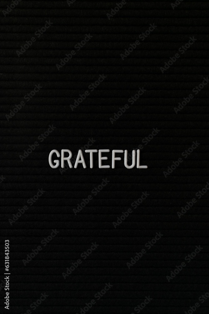 Vertical black spongy board with a text Vertical black spongy board with a text