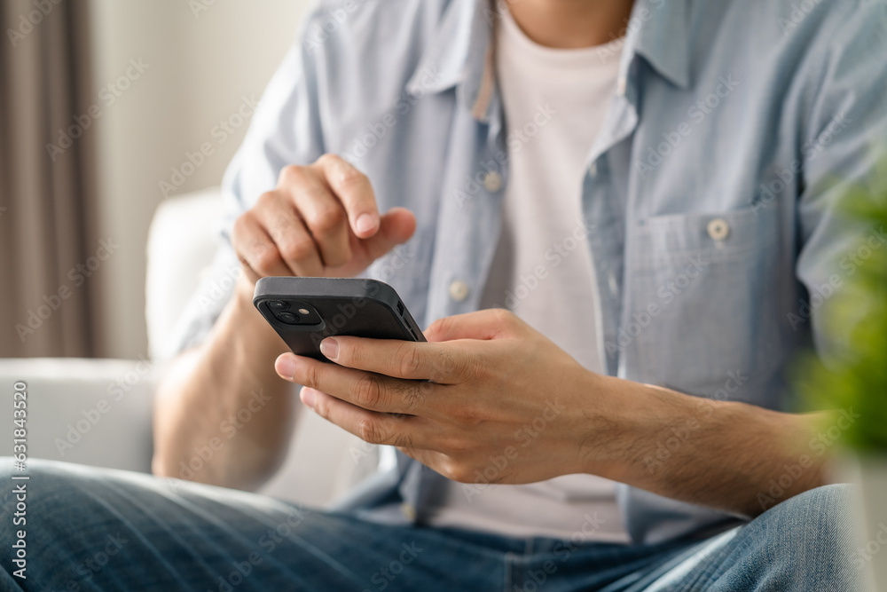 Man using smartphone typing, chatting conversation, watching video live streaming. Social network, technology concept Man using smartphone typing, chatting conversation, watching video live streaming. Social network, technology concept
