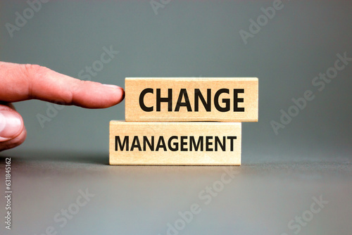 Change management symbol. Concept words Change management on beautiful wooden block. Beautiful grey table grey background. Businessman hand. Business change management concept. Copy space.