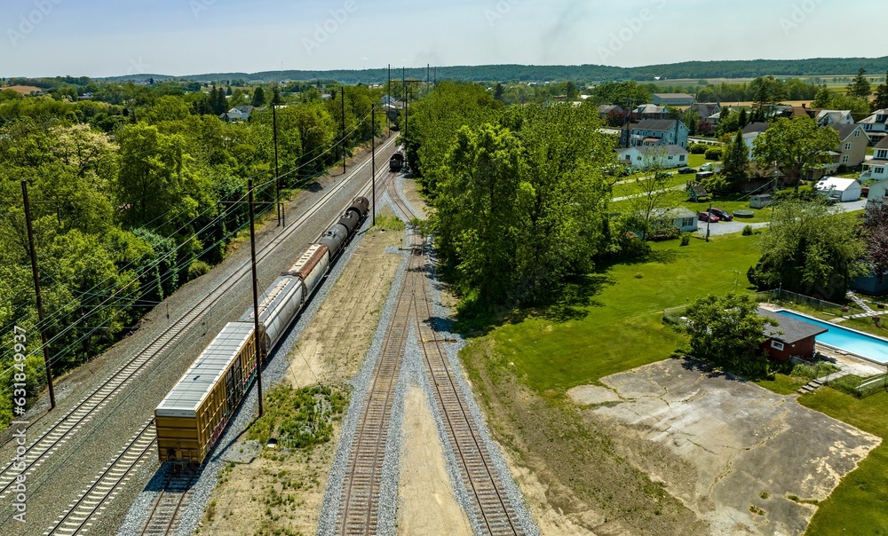 Aerial View of a Steam Locomotive Moving Freight Cars Around in a Freight Yard
