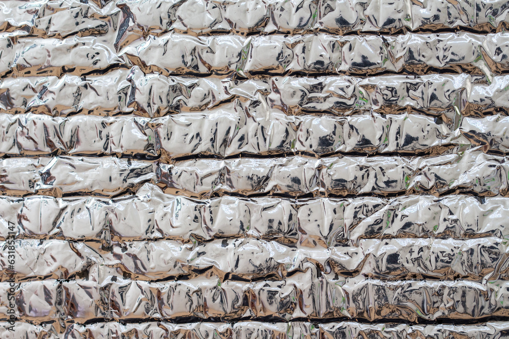 aluminum foil, silver background with glossy matted uneven surface aluminum foil, silver background with glossy matted uneven surface