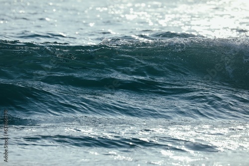 Blue ocean wave creating a soothing atmosphere.