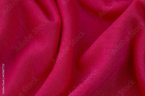 Closeup image of a soft, pink fabric texture with subtle details of the weave visible photo