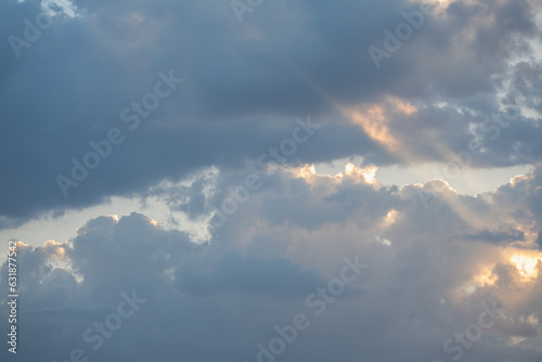 Cloudy Sky with Light Glimmers and Blue Background