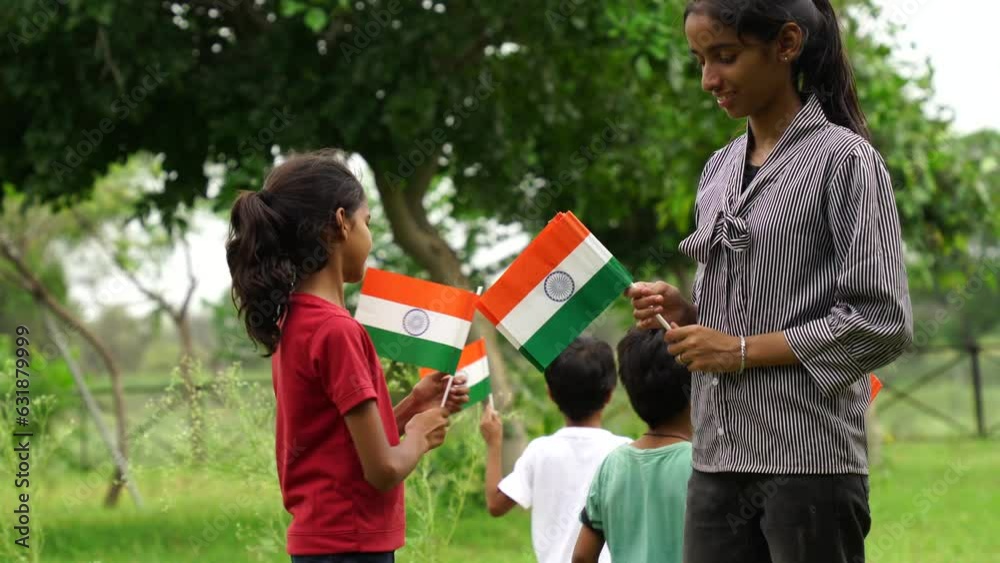 Cute little Indian kids holding, waving or running with Tricolour with greenery in the background, celebrating Independence or Republic day Cute little Indian kids holding, waving or running with Tricolour with greenery in the background, celebrating Independence or Republic day