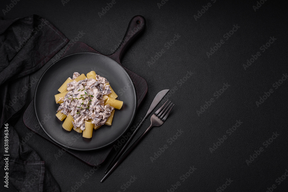 Delicious fresh pasta with champignon mushrooms in a creamy sauce Delicious fresh pasta with champignon mushrooms in a creamy sauce