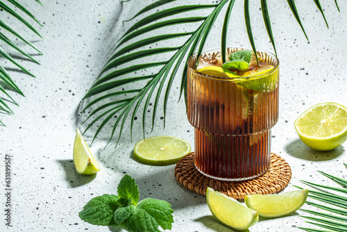 Photography Cuba Libre Drink with fresh lime, rum, cola, mint in the glass