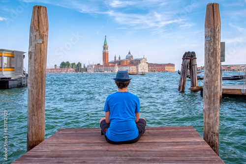 Boy on the pontoon looking at the Basilica of San Giorgio Maggiore © Cornel