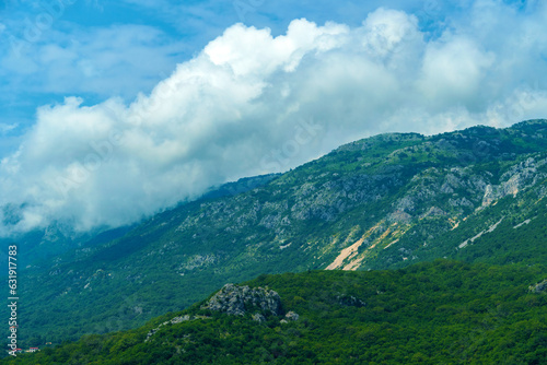Fototapeta Naklejka Na Ścianę i Meble -  beautiful mountains, summer landscape, clouds, forest on the hillsides