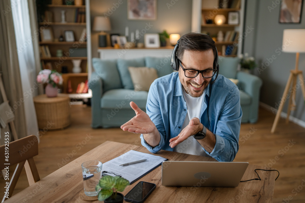 One man caucasian male freelancer work from home on laptop computer One man caucasian male freelancer work from home on laptop computer