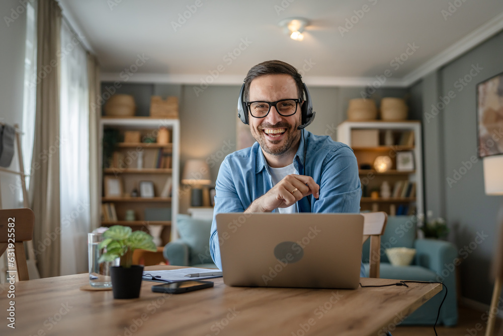 One man caucasian male freelancer work from home on laptop computer One man caucasian male freelancer work from home on laptop computer