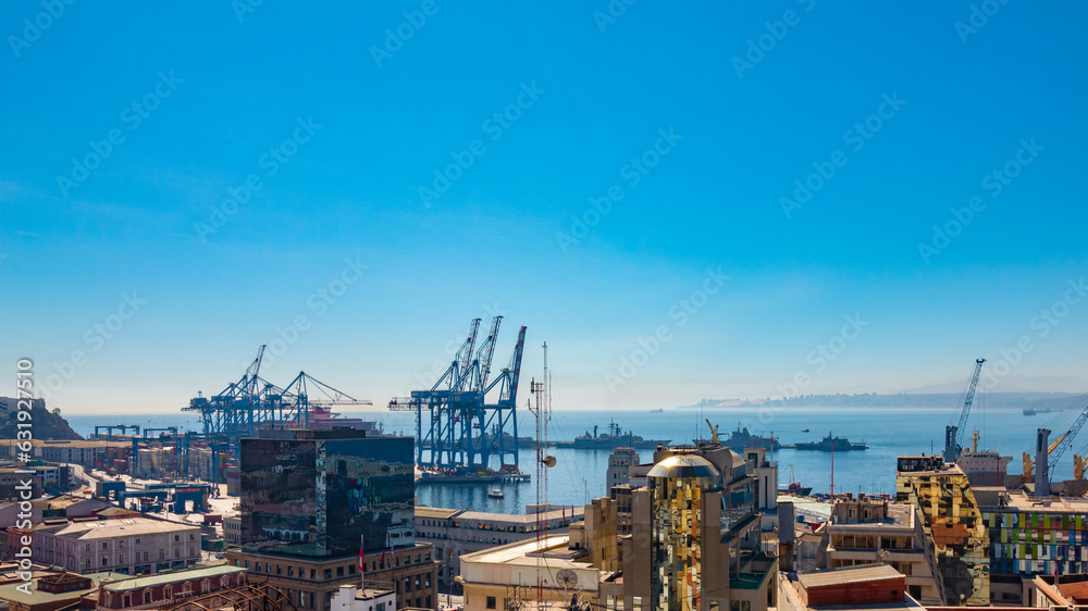 ships, containers, boats and crane in the port of Valparaiso in Chile