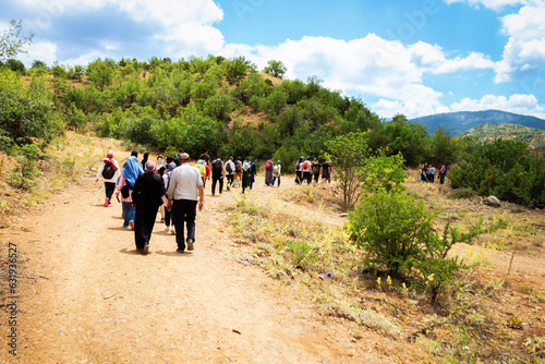 Young and old, men and women trekking. Sport in nature.