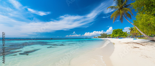 Late afternoon photo of white sandy beach with blue water and sunshine background 