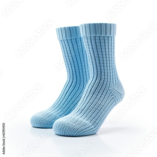 pair of baby blue home made knitted socks isolated on a white background, generative ai 
