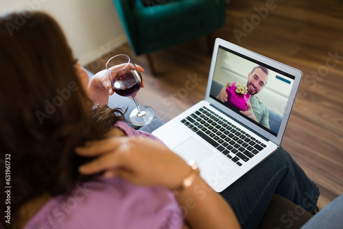 Happy couple having a romantic virtual date during a videocall