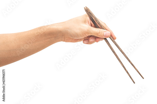 isolated of a man's hand holding a wood chopstick.