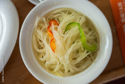 A bowl of Chinese food, fried shredded potatoes