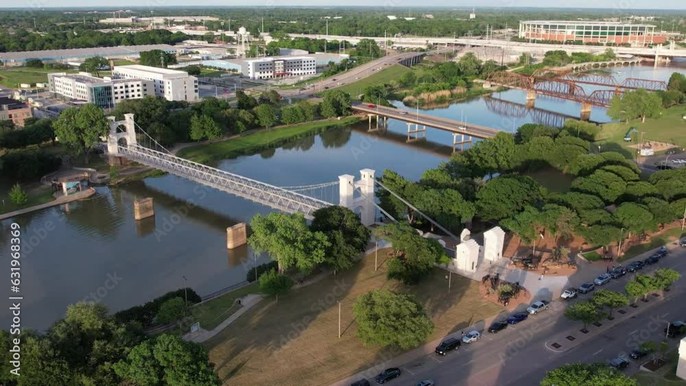 drone shot of the suspension bridge in downtown waco texas 4k