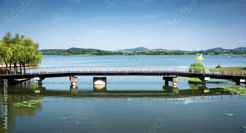 covered bridge in beautiful city park © evening_tao