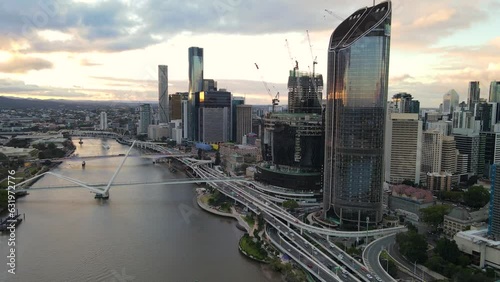 Aerial drone view of Brisbane City, QLD, Australia showing the west facing side of the city along Brisbane River and Riverside Expressway and Neville Bonner Bridge during late afternoon in August 2023 photo
