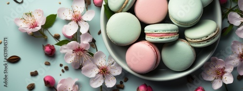 Mint green macaroons with pink peony flower. Mood board flat lay.