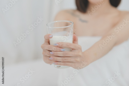 Young attractive girl Spanish appearance delighted with the surprise. And The Morning Started With An Unexpected Healthy Breakfast. In surprise, she waved her hands and rejoices at what is happening.