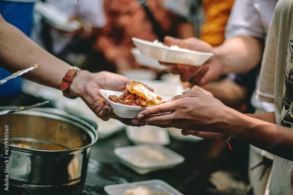 The help of volunteers helps to donate free food to the starving people.