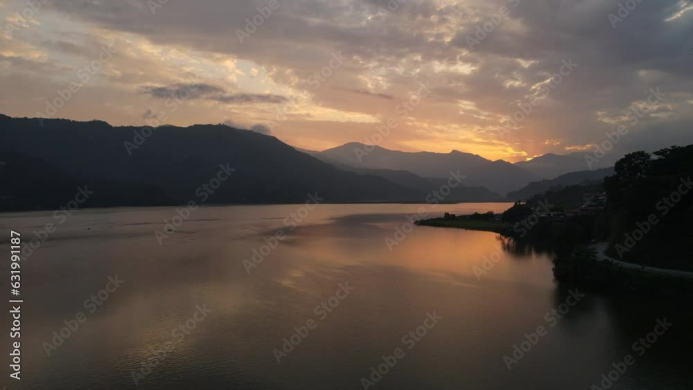Aerial view of calm Phewa Lake with floating boats in the Nepal Valley during a beautiful sunset. 4k footage. Aerial view of calm Phewa Lake with floating boats in the Nepal Valley during a beautiful sunset. 4k footage.